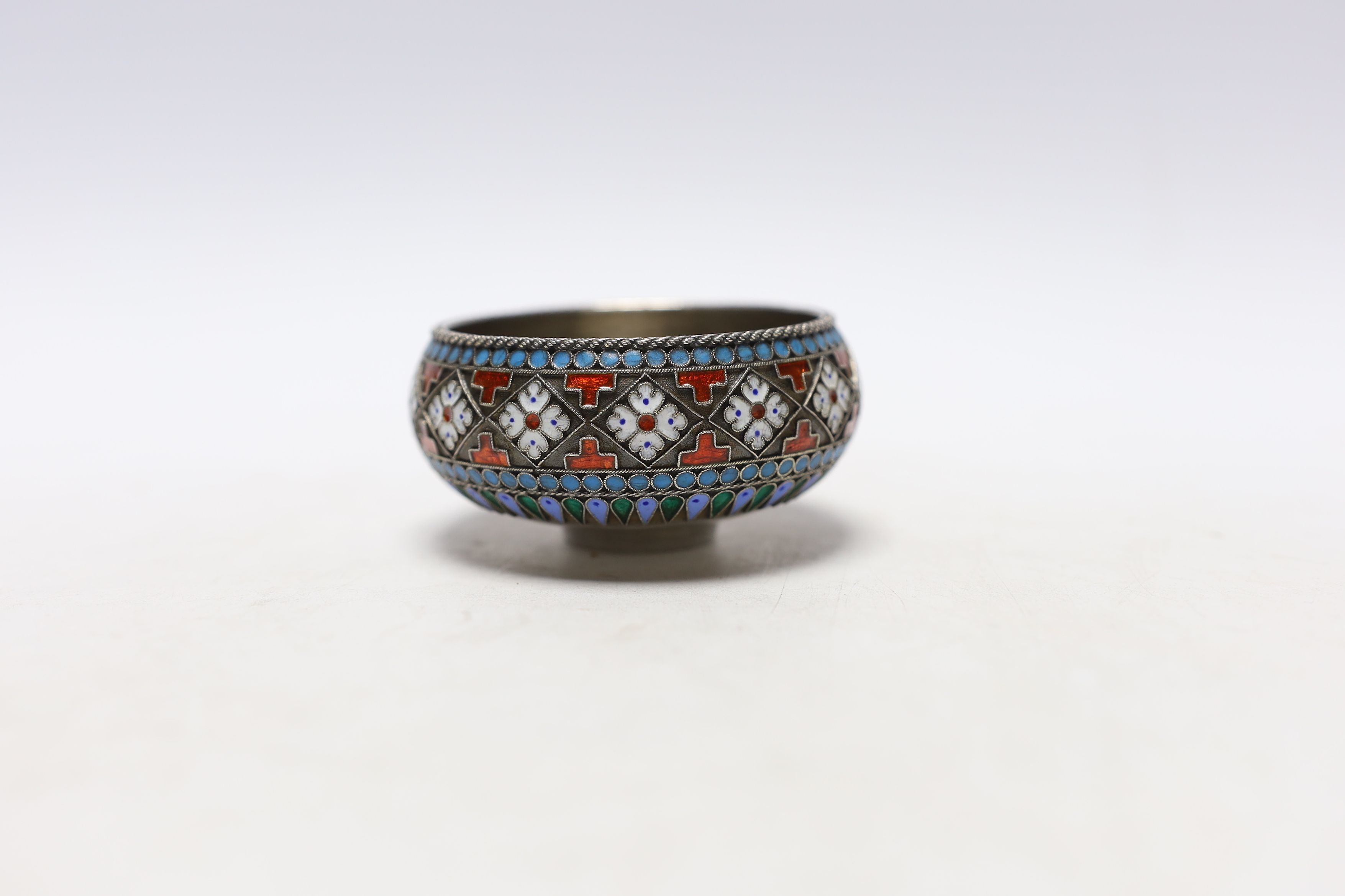 A late 19th century Russian 84 zolotnik and cloisonné enamel salt, assay master Lev Oleks, master Pavel Ovchinnikov, width 75mm, gross weight 58 grams.